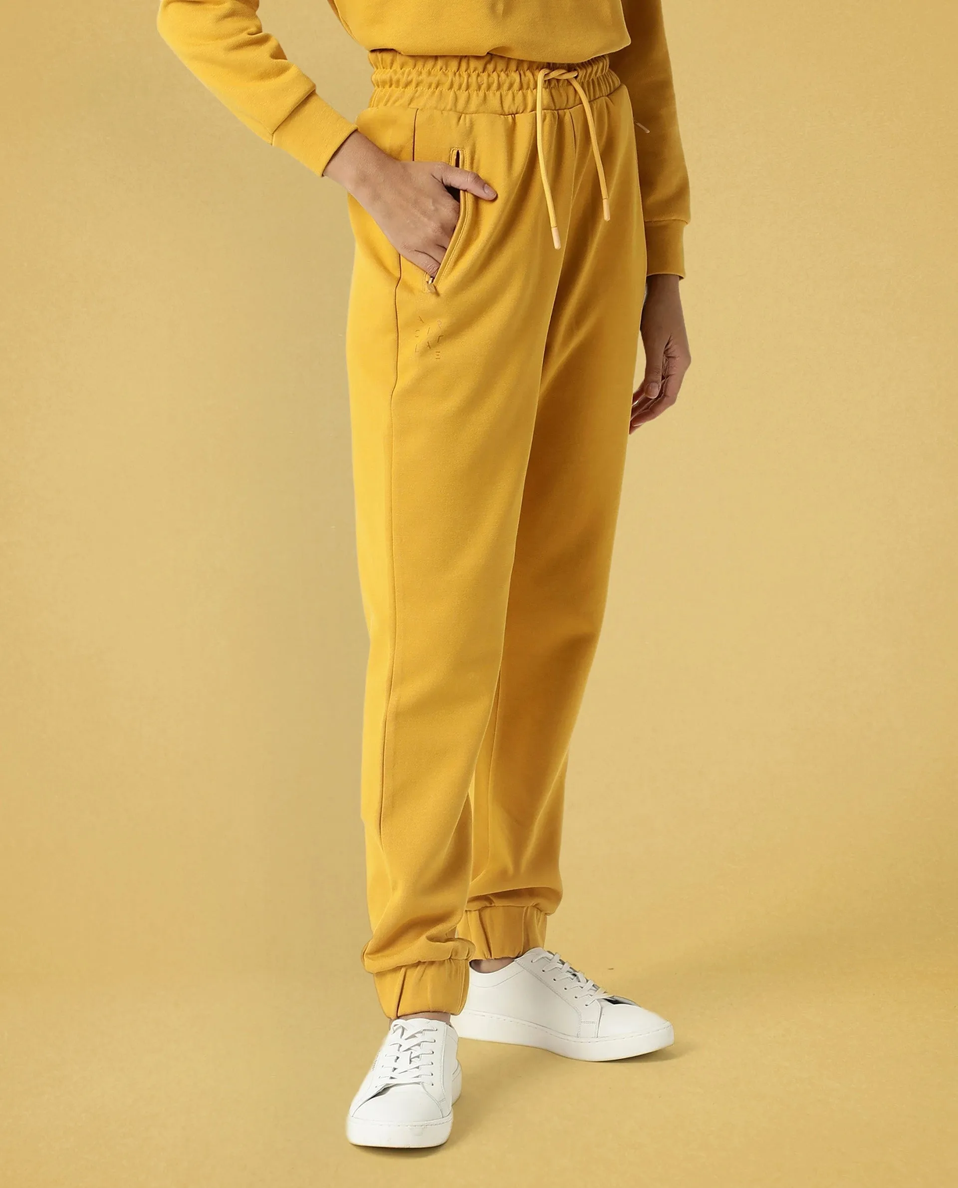 Rareism Women Creta Mustard Cotton Blend Fabric Relaxed Fit Solid Mid Rise Ankle Length Track Pant